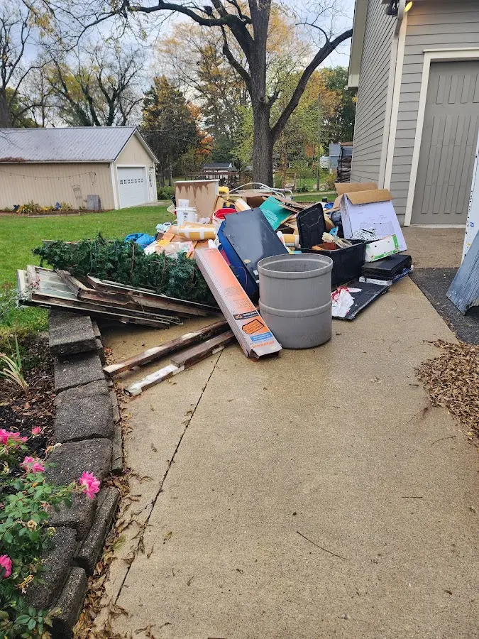 Dumpster being loaded with debris for Commercial Dumpster Rental in Okemah